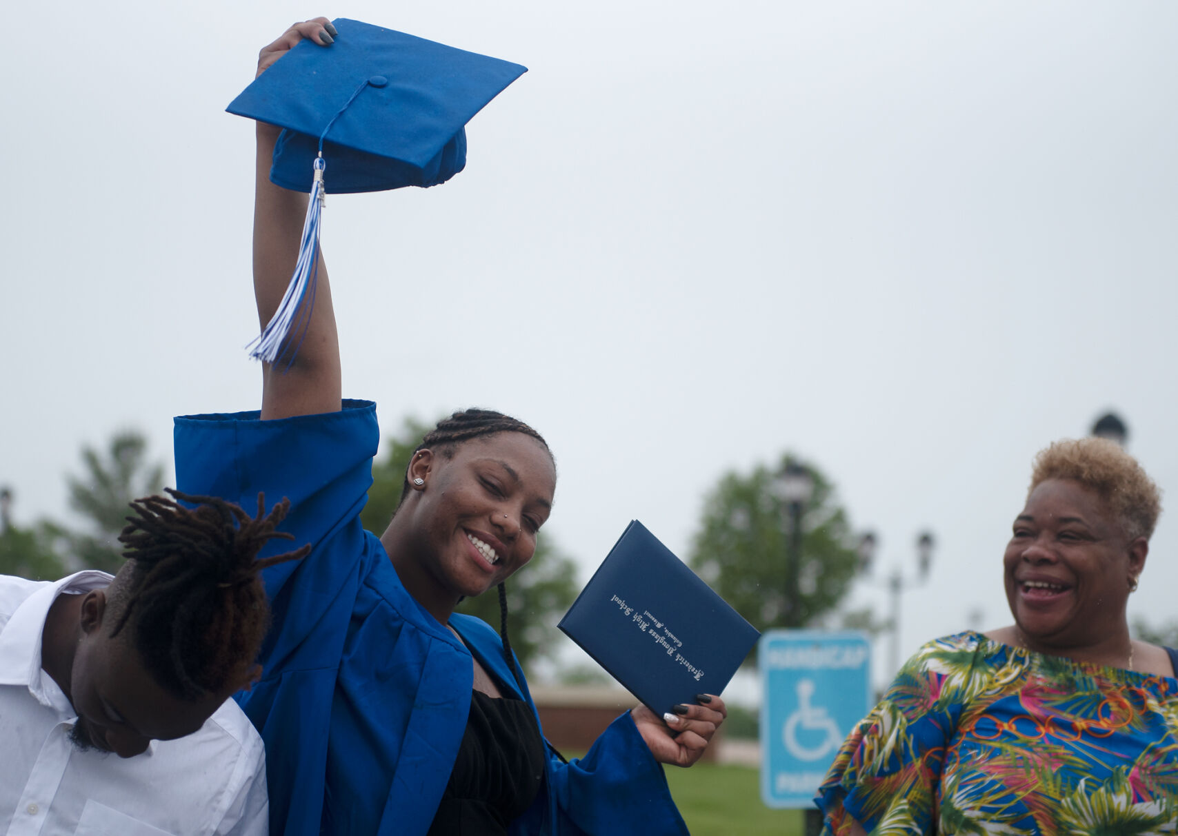 Shakara Turner holds her graduation cap
